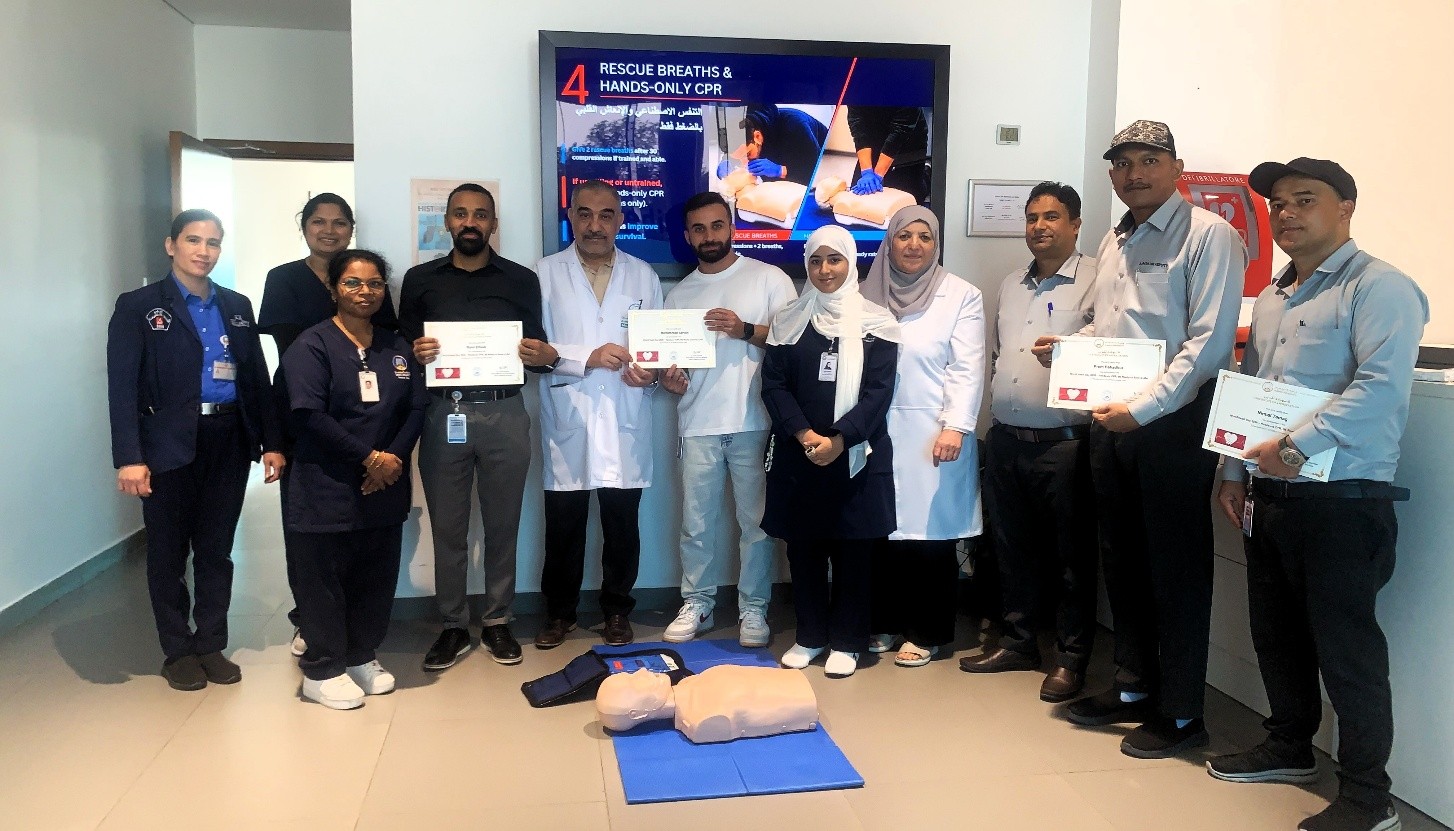 Group with certificates at CPR training event.
