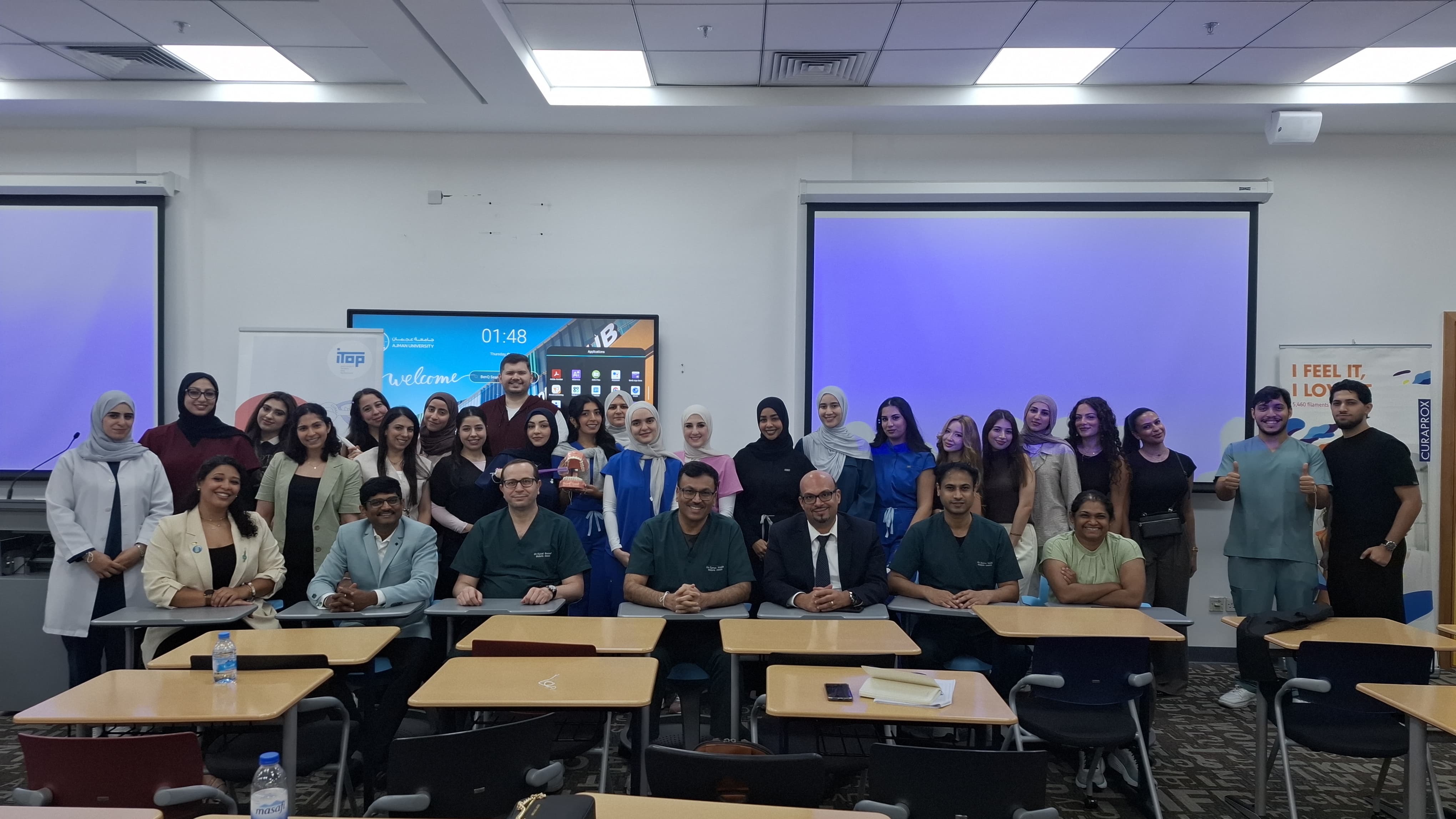 Group photo in a classroom setting.